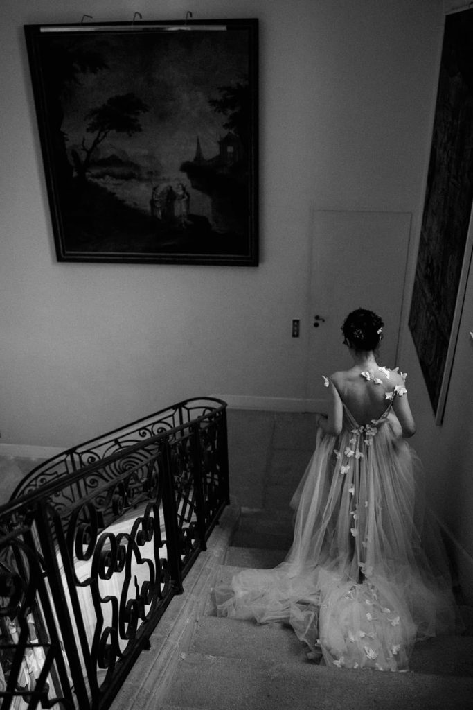 Bride walking for first look chateau de details from a wedding at Chateau de Tourreau