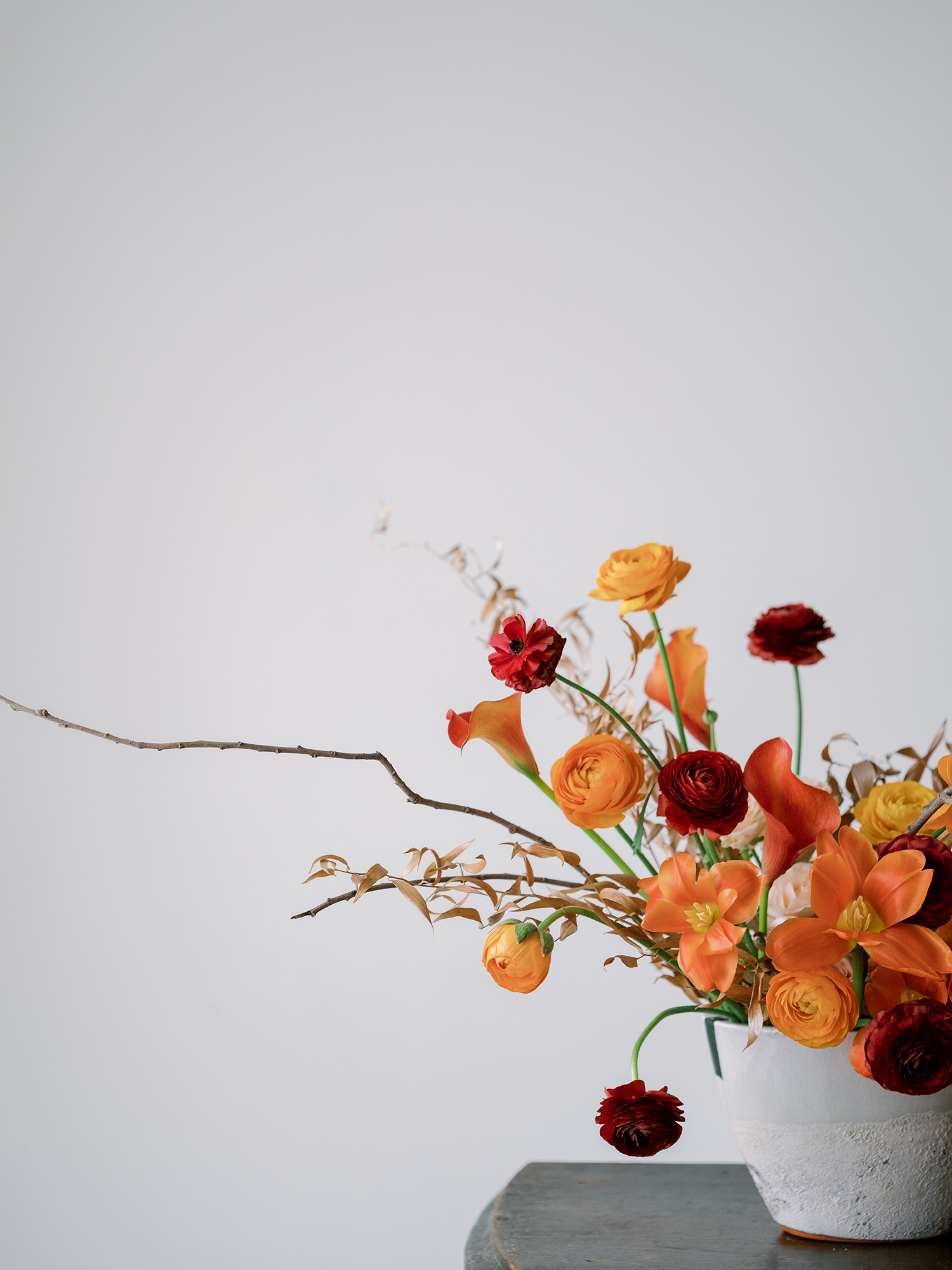 Colorful wedding centerpiece using modern ceramic for vessels