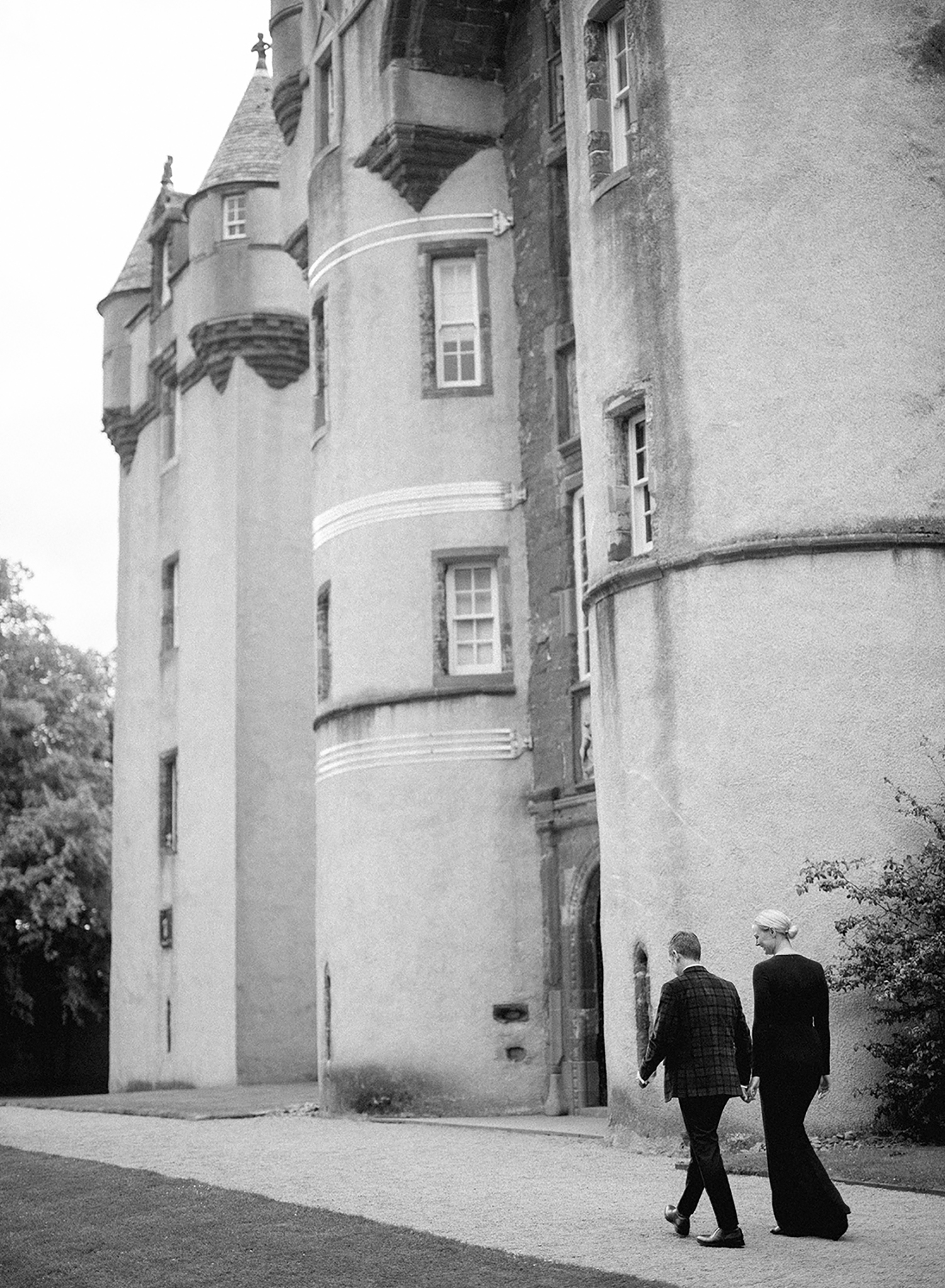 Couple walking outside of Castle Fyvie.