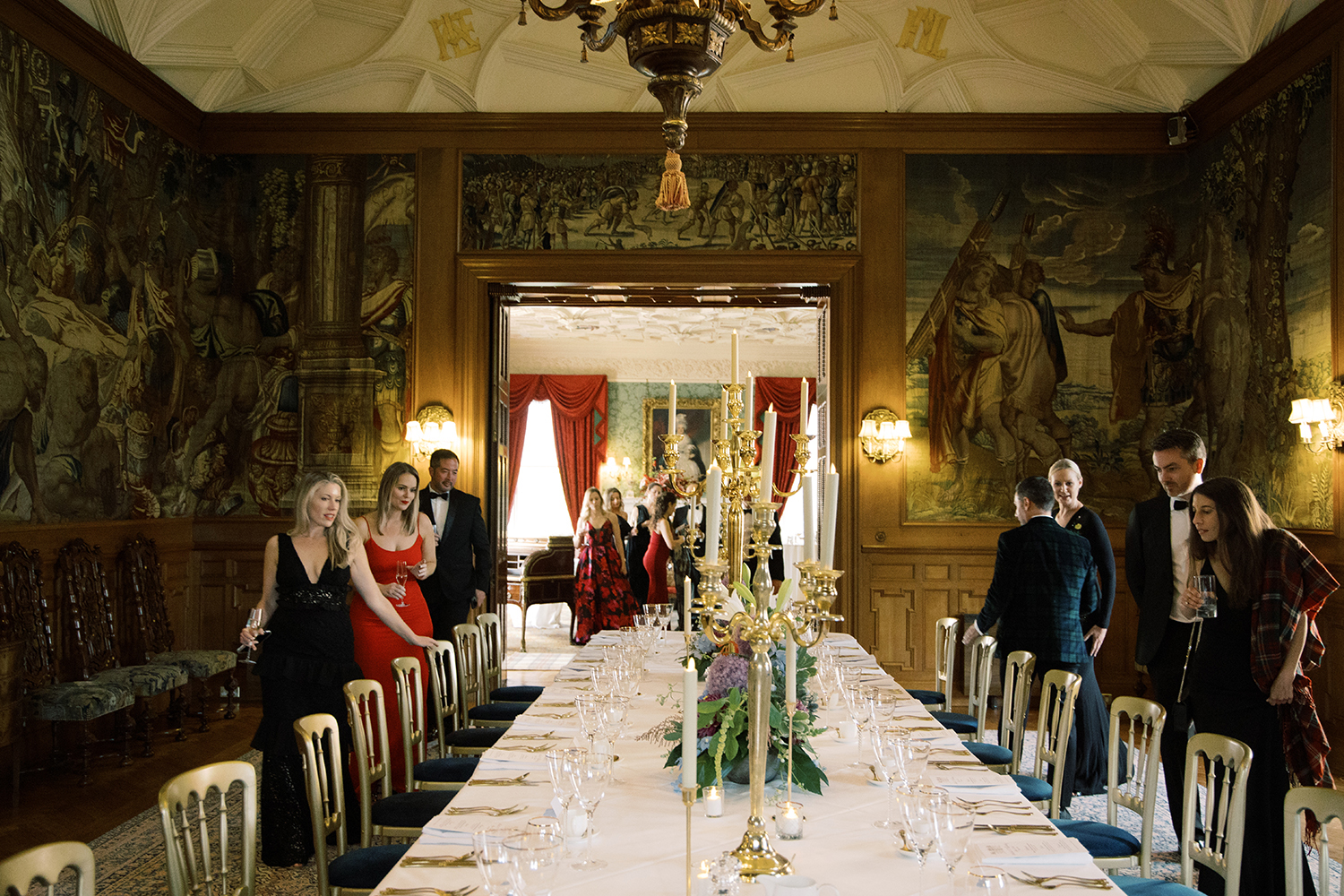 Guest entering the dinner room at this black tie surprise party at Fyvie Castle in Scotland